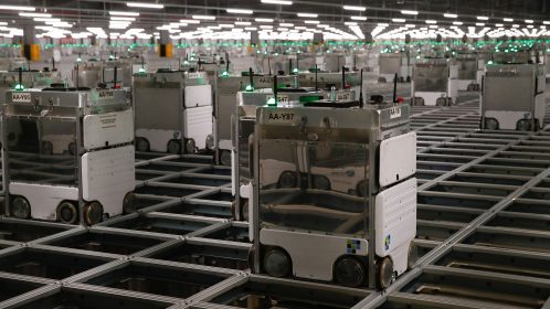 Ocado robots are seen inside a warehouse in Erith